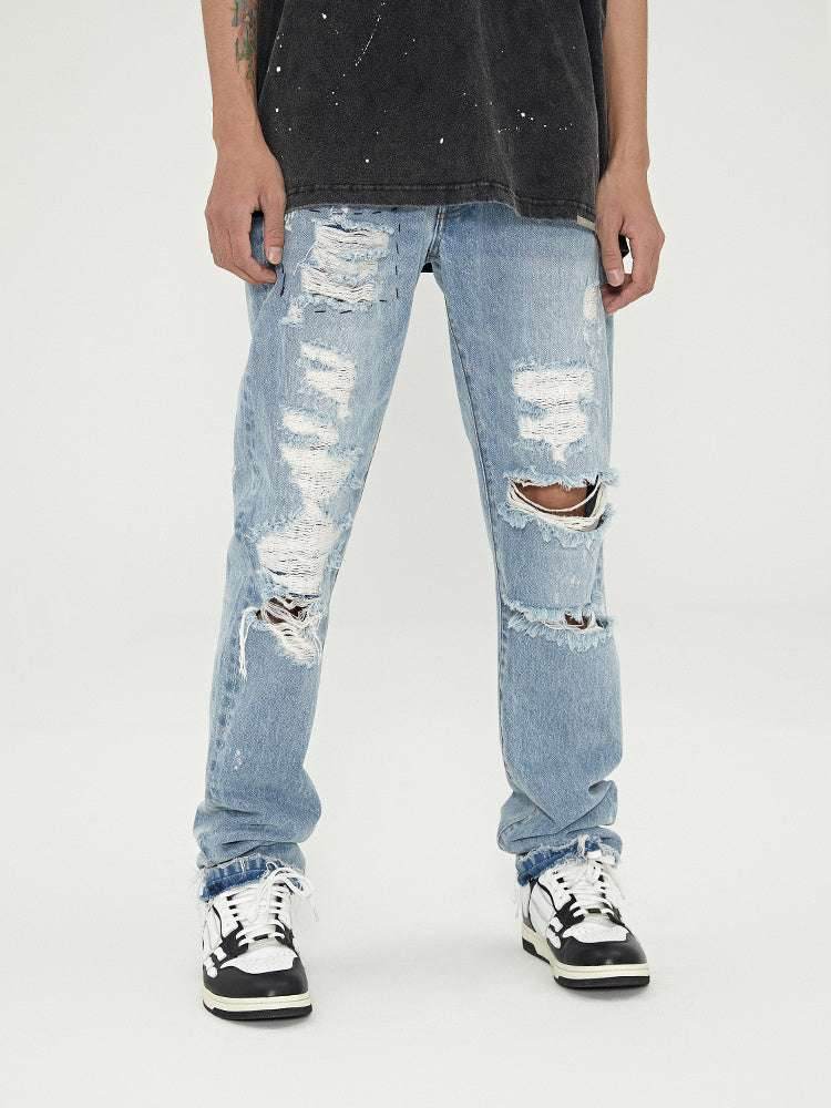 Distressed Washed Retro Light-colored Jeans With Ripped Raw Edges Blue MuddyStock