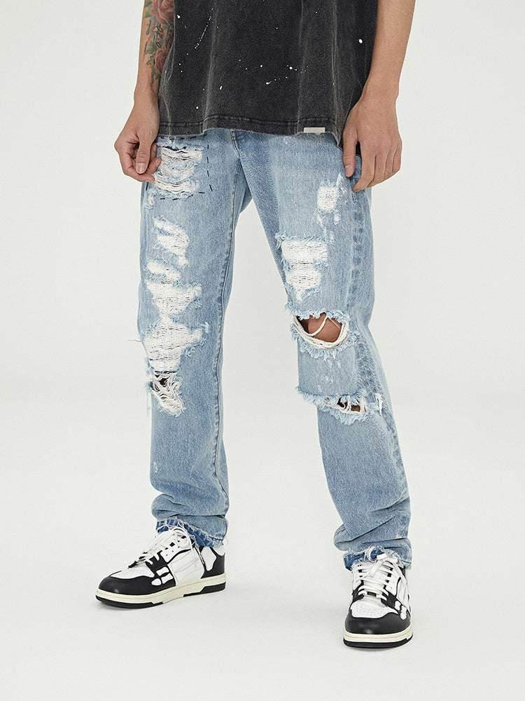 Distressed Washed Retro Light-colored Jeans With Ripped Raw Edges MuddyStock