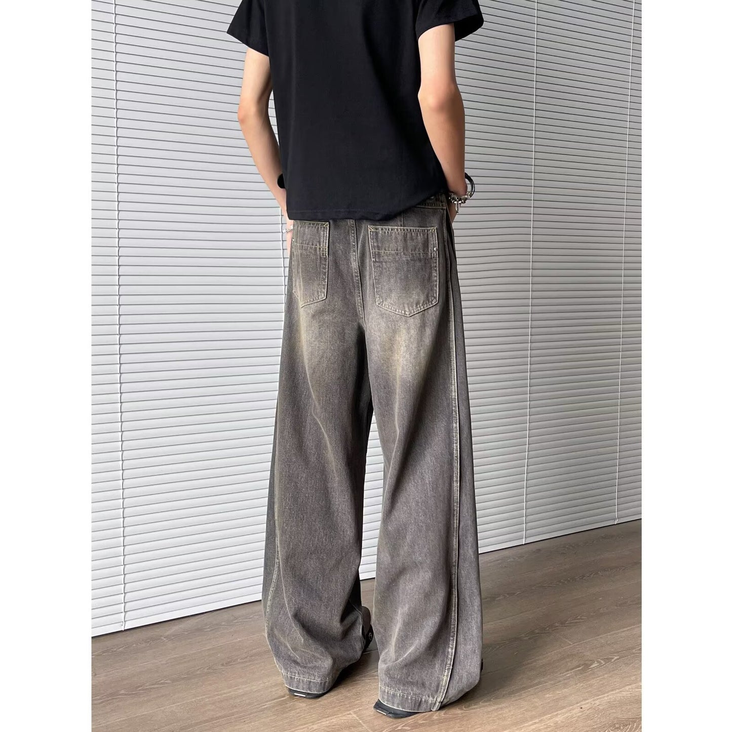 Deconstructed and spliced washed curved knife jeans for men | MuddyStock Originals MuddyStock