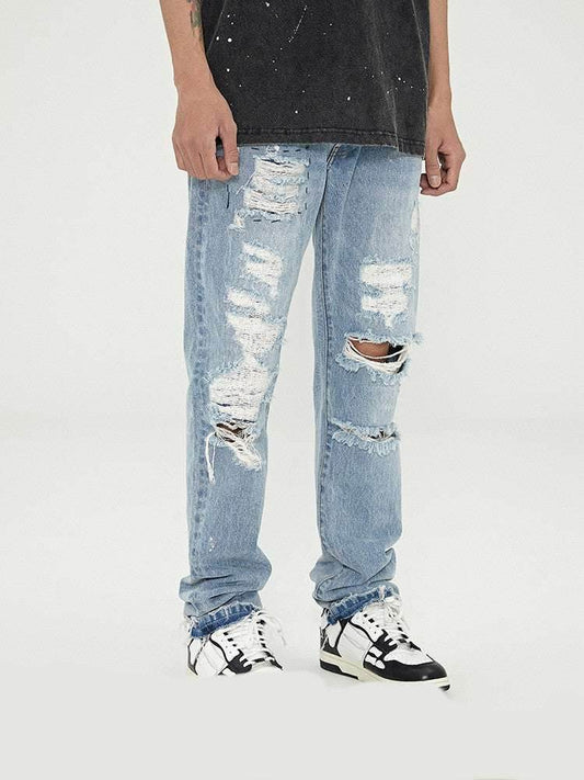 Distressed Washed Retro Light-colored Jeans With Ripped Raw Edges MuddyStock