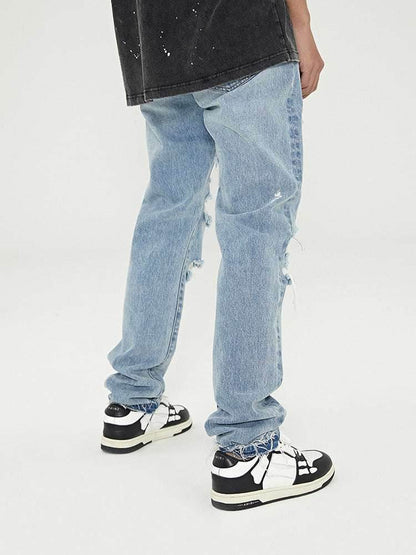 Distressed Washed Retro Light-colored Jeans With Ripped Raw Edges MuddyStock
